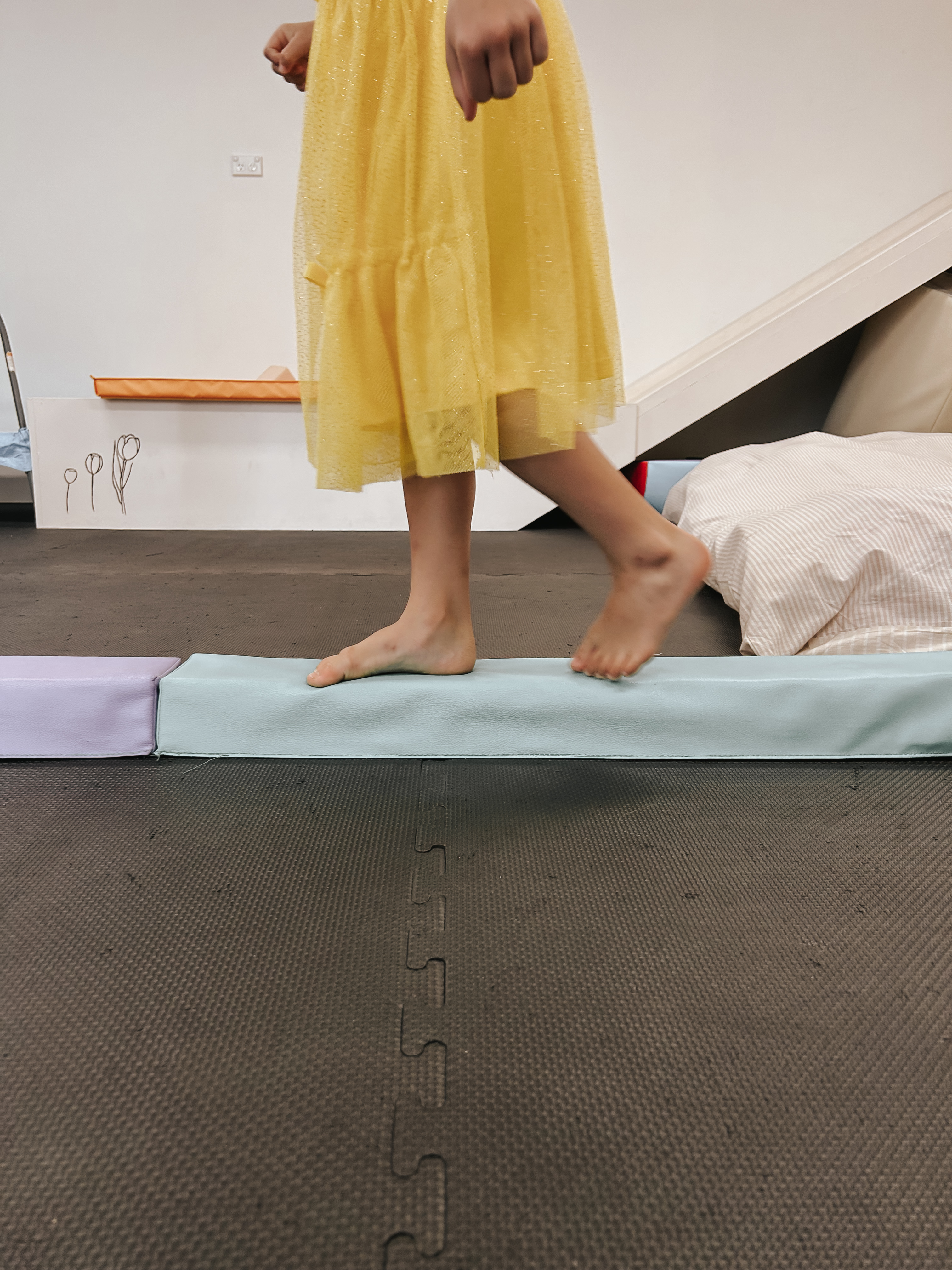 Child walking on a balance beam